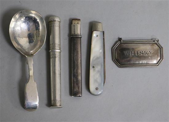 A Victorian silver caddy spoon, a silver whisky label, a Norwegian needlecase, a silver and mop fruit knife and a silver pencil holder